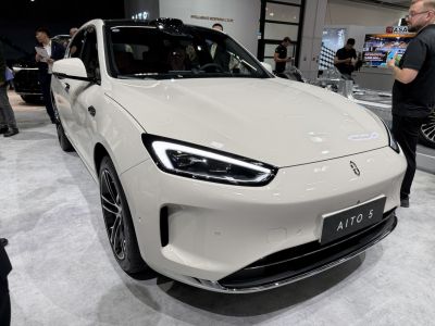 Front view of a car with sleek LED headlights and smooth hood