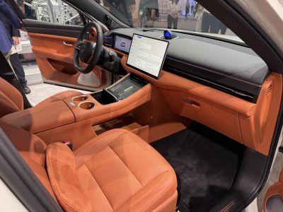 Spacious leather interior with large touchscreen and modern dashboard