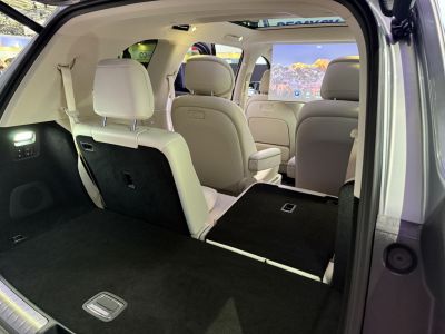 Spacious cargo area with foldable rear seats and beige leather interior