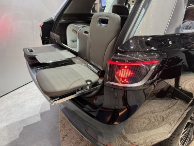 Fold-out rear tailgate seating with integrated champagne cooler.