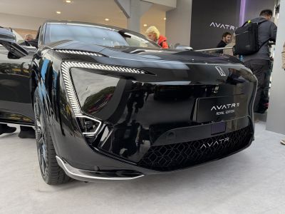 Close-up of front end with distinctive LED headlights and grille design