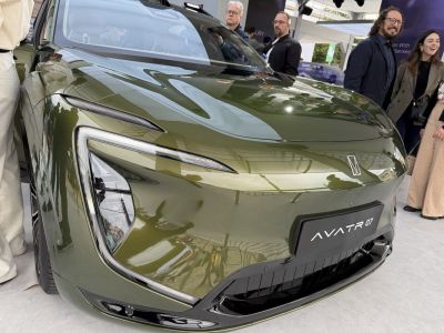 Closeup of sleek front fascia with distinctive headlights and sculpted hood