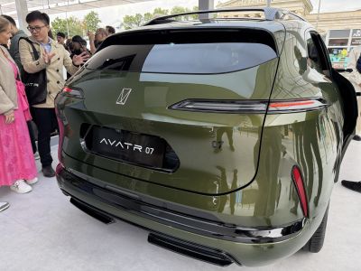 Sleek rear design with LED tail lights and green metallic finish