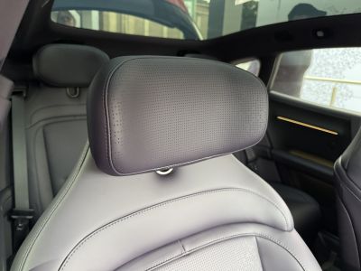 Perforated leather car seat headrest and interior details