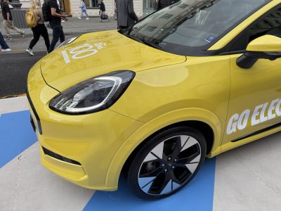 Yellow car front with LED headlights and sporty rims