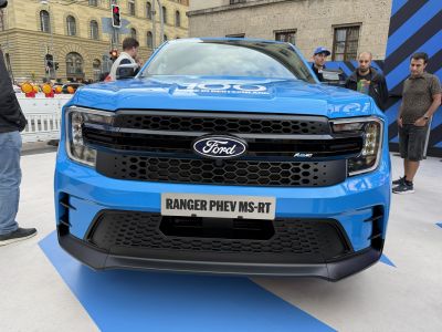 Blue pickup front with honeycomb grille and headlights