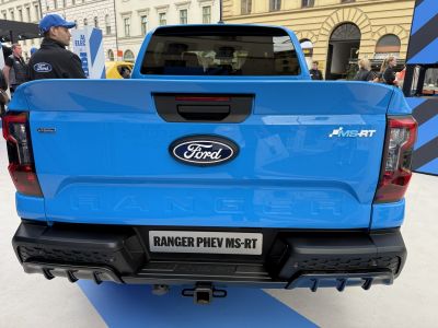 Rear view of hybrid MS-RT pickup tailgate with badges and tow hitch