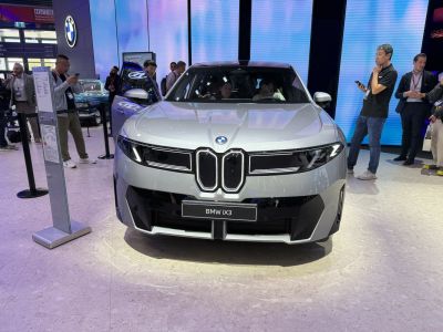 Futuristic front view with kidney grille and LED headlights.