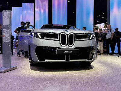 Front view with large kidney grille and sleek LED headlights