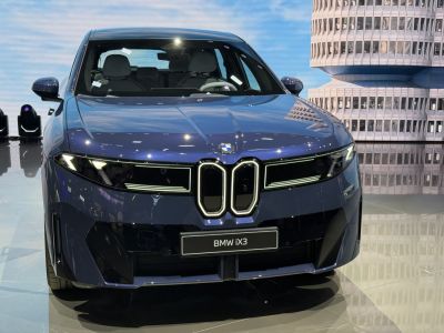 Front view with illuminated grille and sleek LED headlights