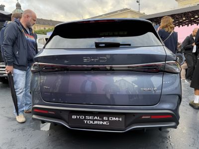 Rear view of a sleek station wagon with modern taillights and rear wiper