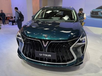 Large black front grille and modern headlights.