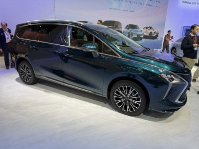 Side view of modern MPV with distinctive front design and alloy wheels