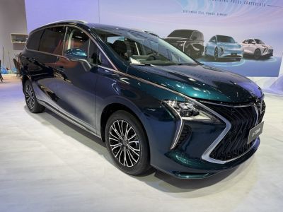 Front view of a modern MPV with sharp lines and LED headlights