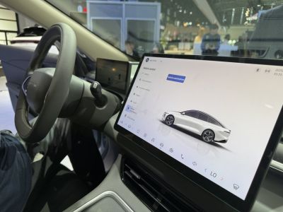 Digital touchscreen display and steering wheel in modern car interior