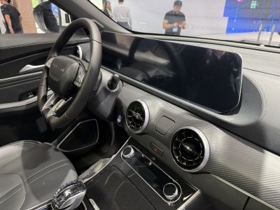 Digital dashboard and circular air vents in a vehicle interior
