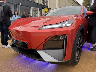 Sleek front fascia and advanced LED headlights with blue underglow lighting.