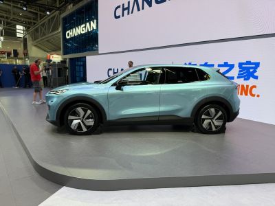 Side profile of a sleek compact SUV with aerodynamic design and distinctive alloy wheels