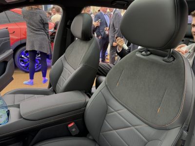 Premium car interior seats with leather and suede upholstery, contrast stitching