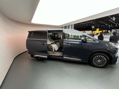 Sliding door open revealing spacious, luxurious interior seating