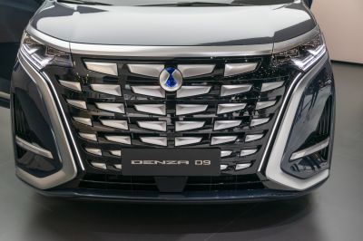 Close-up of front grille and LED headlights with badge