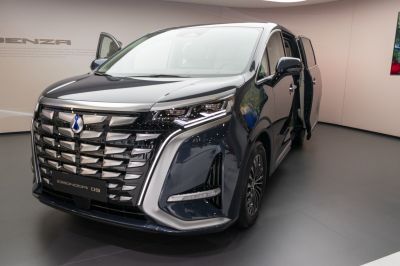 Front grille and open sliding door with modern headlights.