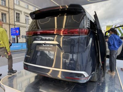 Sleek rear with split continuous taillight and vertical rear door