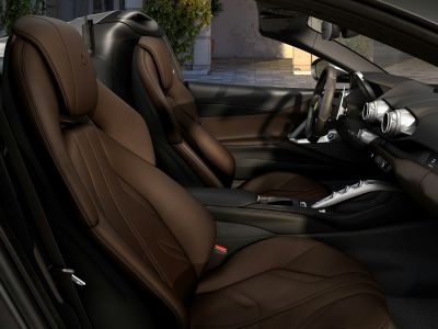 Premium brown leather seats and sophisticated dashboard design.