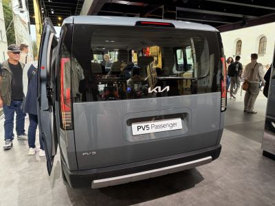 Rear view of van with large window and sliding door open