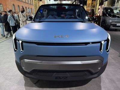 Futuristic front fascia with dual vertical LED lights and smooth hood design