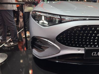 Close-up on modern front grille and LED headlight design with air intake vents