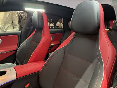Two-tone red and black leather sport front seats with detailed stitching.