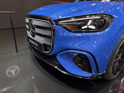 Close-up of electric SUV front grille and LED headlight design