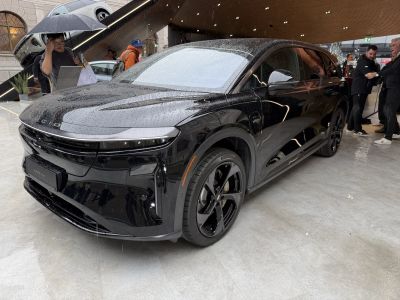 Black luxury SUV with sleek LED headlights and aerodynamic body