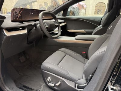 Futuristic digital dashboard and premium leather seats with wood trim