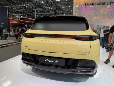 Rear view with continuous LED tail light strip and hatchback design