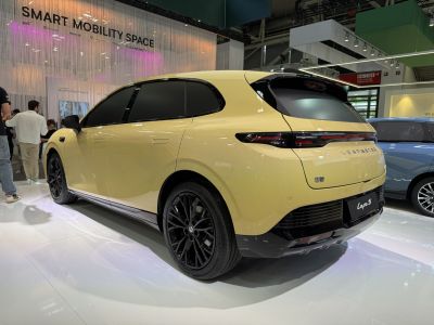 Rear-side view of a sleek hatchback with modern lighting and black alloy wheels