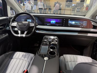 Digital instrument cluster, dual wide infotainment displays, wireless charging pad.