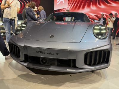 Front view with circular headlights and aggressive grille design