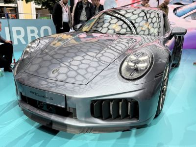 Front view with round LED headlights and aerodynamic vents