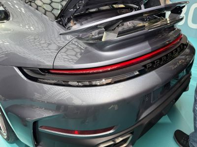 Rear view close-up with aerodynamic spoiler and continuous tail light