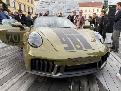 Front view of convertible with race stripes and distinctive grille