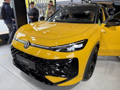 Yellow SUV front with distinctive grille and LED headlights