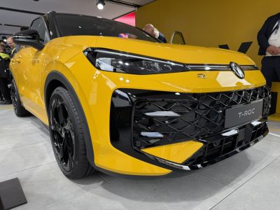 Close-up of car front with sharp headlights and bold grille