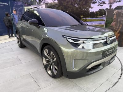 Futuristic electric SUV front with aerodynamic LED headlights and large alloy wheels