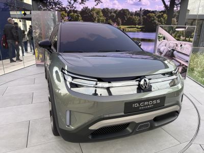Front view of a futuristic electric SUV with sleek headlights and grille design.