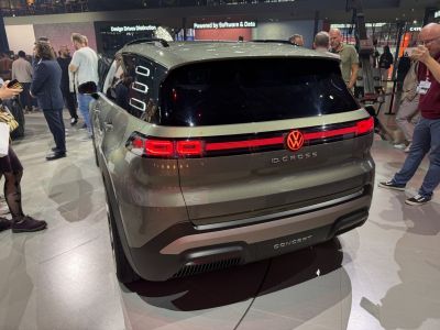Rear view of electric SUV with distinctive LED tail lights and illuminated emblem