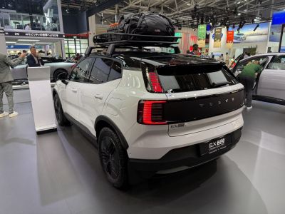 Rear view with LED taillights and loaded roof rack.