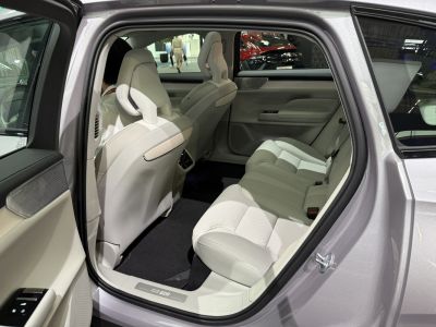 Spacious rear passenger seat with light leather upholstery