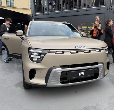 Front view with modern LED headlights and distinct grille